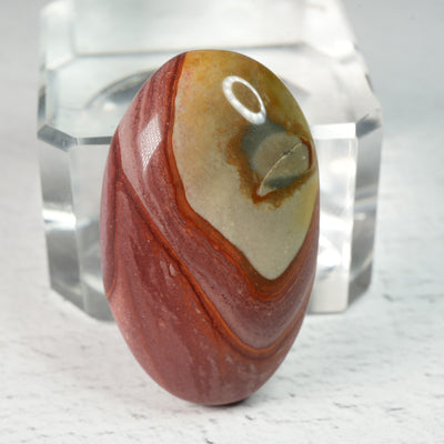 Polished gemstone cabochons in assorted shapes and sizes, natural crystal cabochons with smooth domed tops for artisan jewelry making and mineral collections.