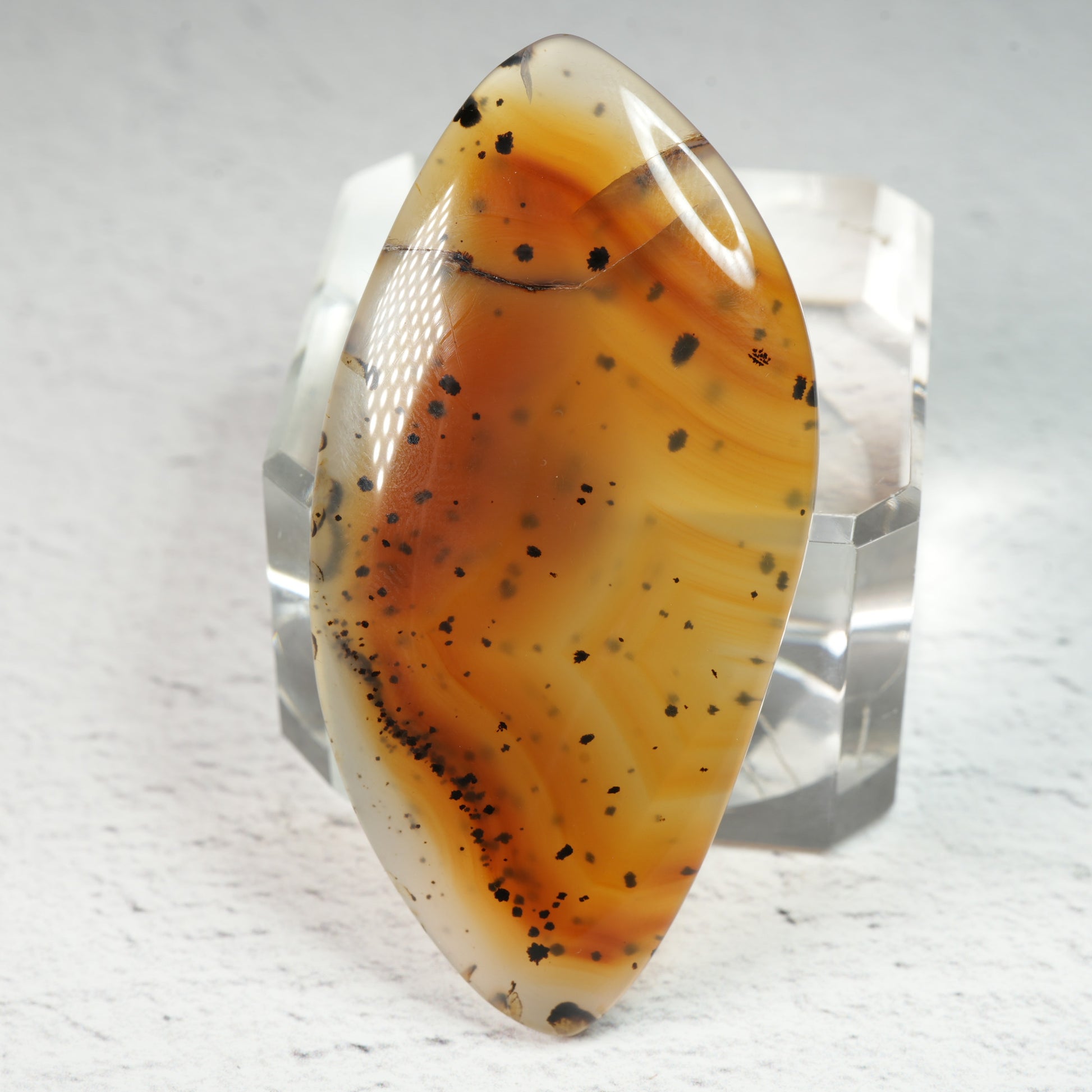 Natural crystal cabochons with smooth polished surfaces showcasing banding, dendrites, and chatoyancy, ideal cabochons for wire wrapping and metalsmith projects.